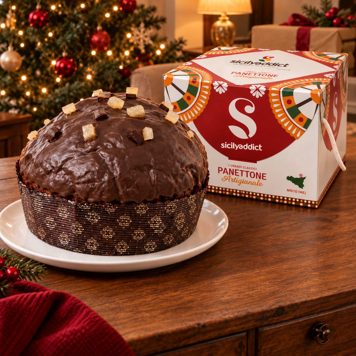 Panettone Pera e Cioccolato accanto alla confezione regalo.