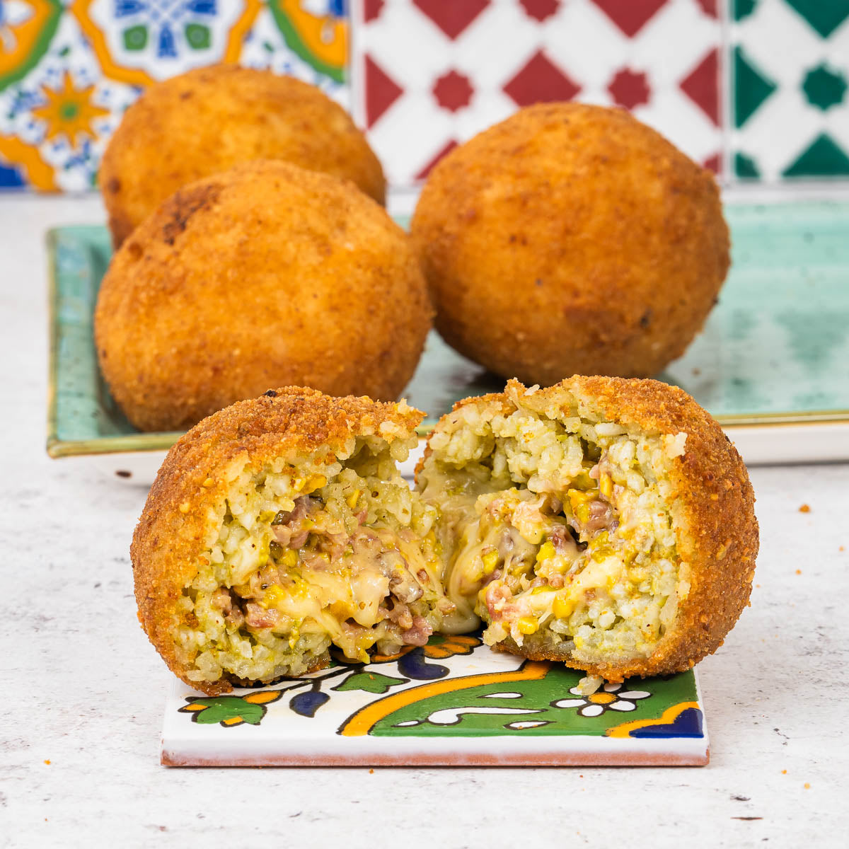 Arancini mit Pistazie und Speck 200 g – 4 Stück