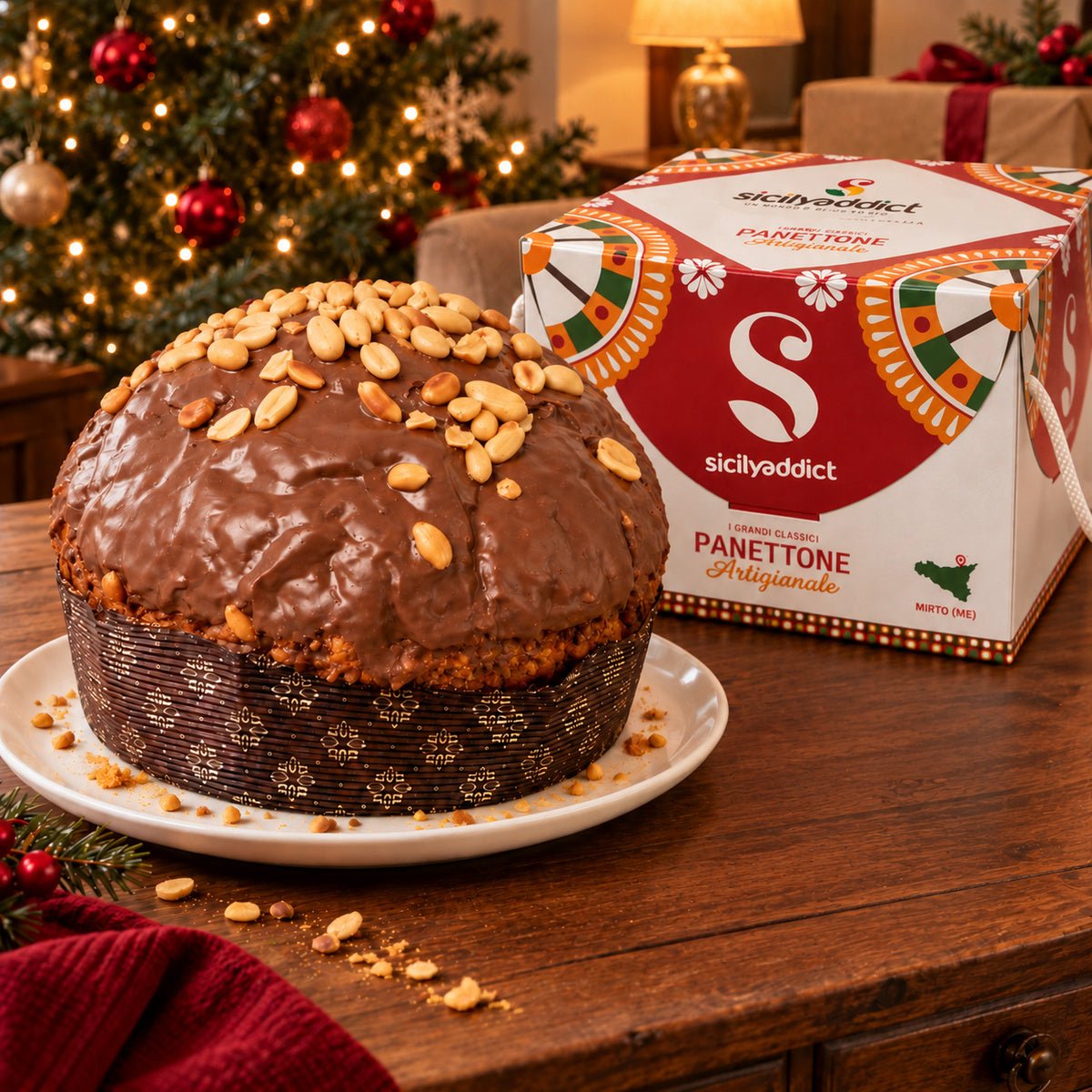 Panettone Caramello, Cioccolato e Arachidi accanto alla confezione regalo.